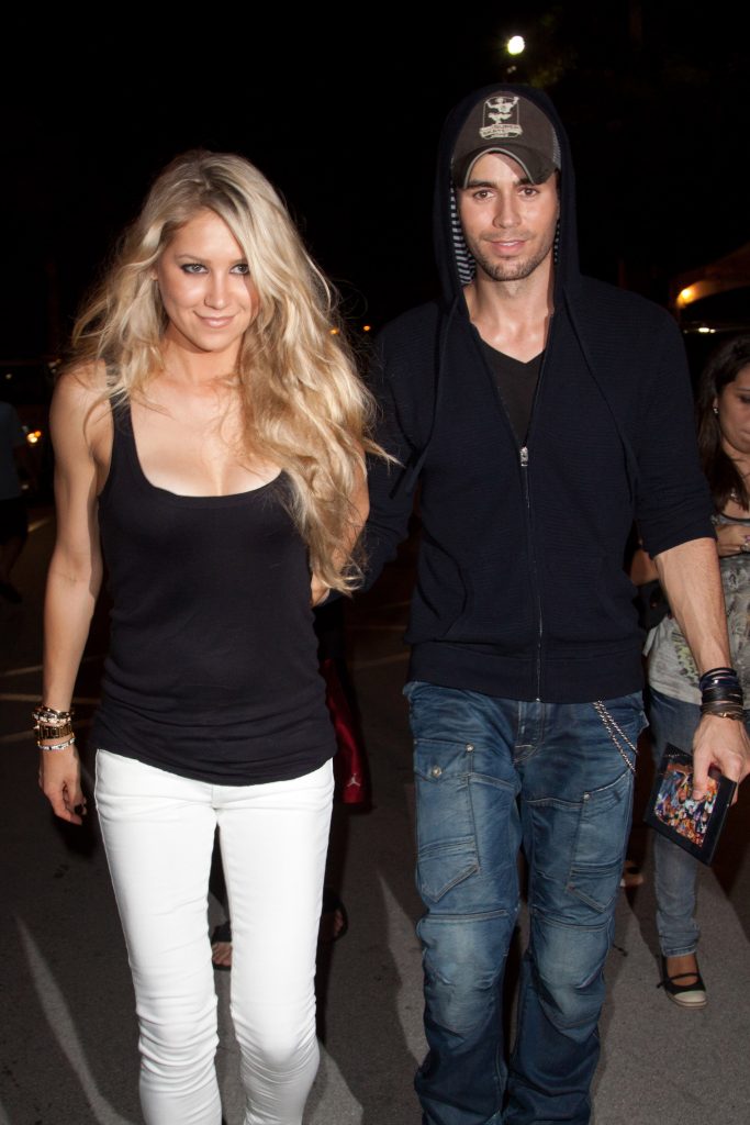 Anna Kournikova and Enrique Iglesias leave the Orange Carpet for the Miami Dolphins versus New York Jets game at Sun Life Stadium on September 26, 2010 in Miami, Florida.