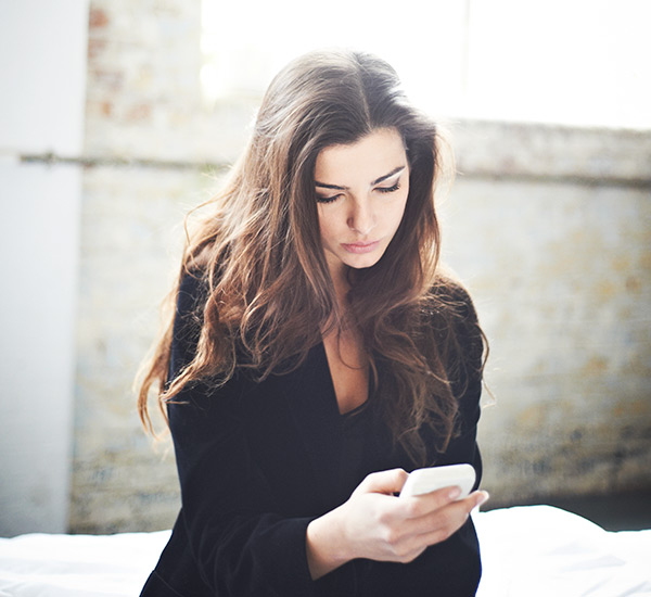 woman-looking-at-phone-600